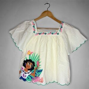 New DISNEYS ENCANTO MIRABEL SHIRT Kids Cream Top w/ Colorful Print Lg (10/12)